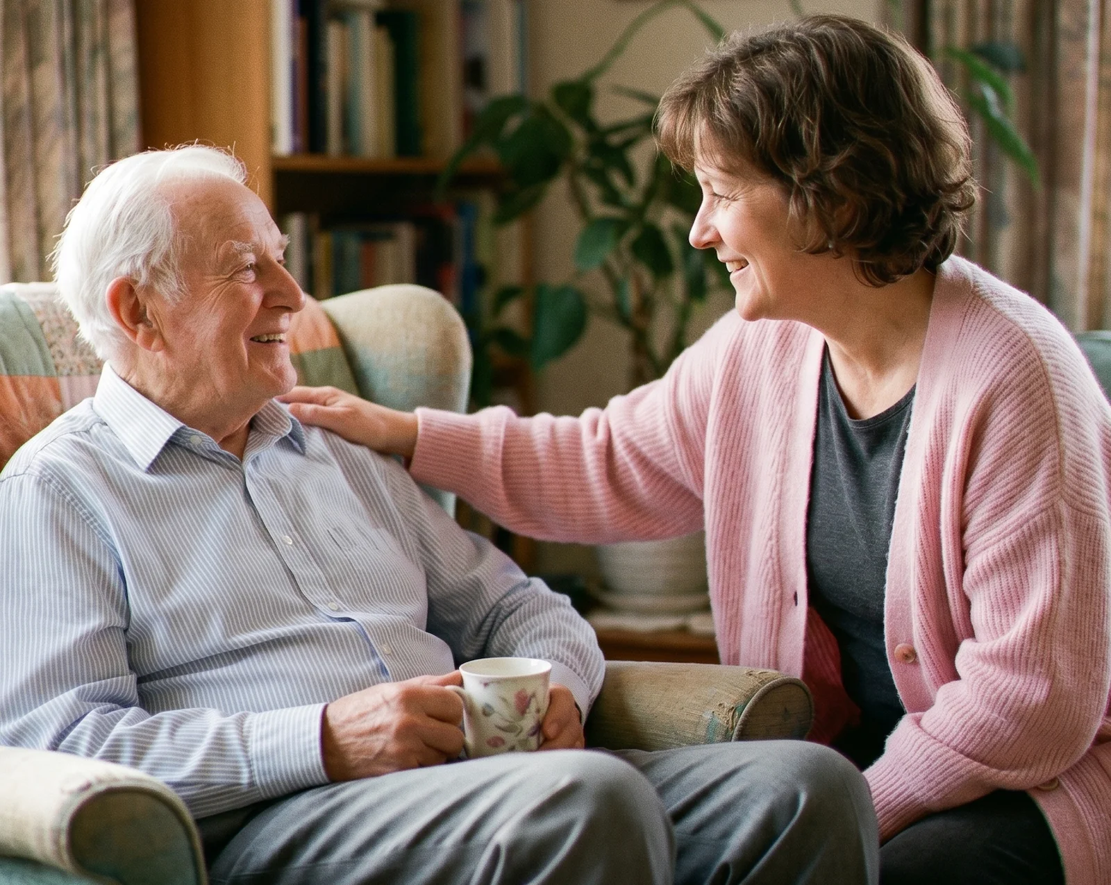 A caregiver warmly supporting an older adult at home